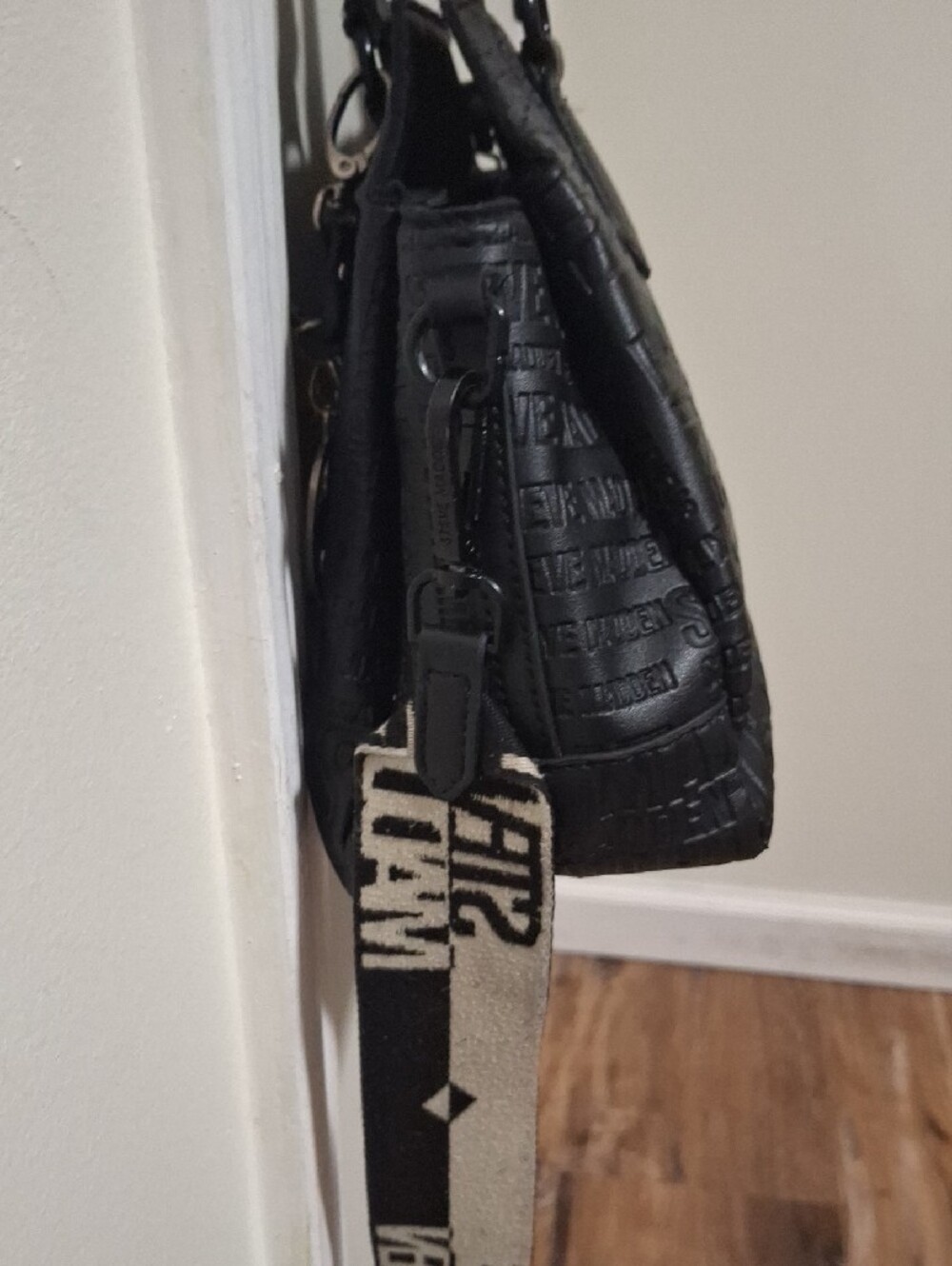 Steve Madden Black Embossed Logo Crossbody Satchel with Branded Guitar Strap - Picture 9 of 14